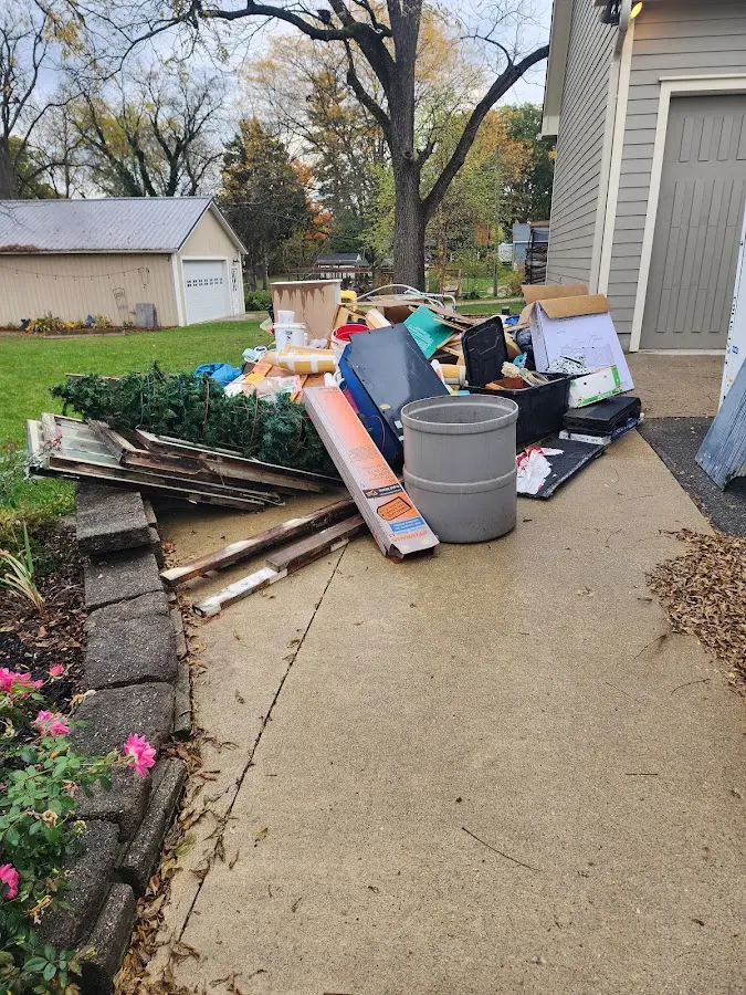 Dumpster being loaded with debris for 3 Yard Dumpster Rental in Gold Canyon